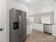 Featuring stainless steel appliances, white cabinets, and granite countertops, a cook's dream at 7125 Jerimoth Dr, Charlotte, NC 28215