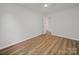 A bright bedroom featuring wood-look floors and a neutral color scheme at 821 1St St, Kings Mountain, NC 28086
