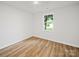 Bright bedroom featuring hardwood floors and a window providing natural light at 821 1St St, Kings Mountain, NC 28086