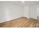 A bright bedroom featuring wood-look floors and a neutral color scheme at 821 1St St, Kings Mountain, NC 28086