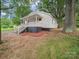 Charming home with a welcoming front porch, complemented by mature trees and fresh landscaping at 821 1St St, Kings Mountain, NC 28086