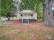 Charming single-story home featuring a cozy front porch and newly landscaped garden, creating a welcoming curb appeal at 821 1St St, Kings Mountain, NC 28086