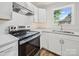 Updated kitchen featuring stainless steel appliances, quartz countertops, and modern cabinetry, ideal for cooking enthusiasts at 821 1St St, Kings Mountain, NC 28086
