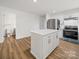 Newly remodeled kitchen with stainless steel appliances, quartz countertops, and a center island offering lots of room to cook at 821 1St St, Kings Mountain, NC 28086