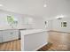 Bright kitchen with quartz countertops, stainless steel appliances, and an adjacent dining area offering spacious and convenient living at 821 1St St, Kings Mountain, NC 28086