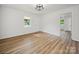 Bright living room with new vinyl floors, a ceiling fan, and ample natural light, creating a comfortable and inviting space at 821 1St St, Kings Mountain, NC 28086