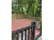 Enclosed wood deck surrounded by greenery and mature trees offering a private outdoor retreat at 101 Treeline Dr, Belmont, NC 28012