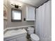 Bright bathroom with a shower, modern fixtures, and vanity lighting at 101 Treeline Dr, Belmont, NC 28012