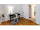 Bright bedroom features hardwood floors, a desk with chair and natural light at 101 Treeline Dr, Belmont, NC 28012