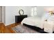 Bright bedroom with hardwood floors, a black dresser and shuttered windows at 101 Treeline Dr, Belmont, NC 28012