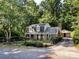 Lovely two-story home showcasing a fenced yard and detached garage with driveway at 101 Treeline Dr, Belmont, NC 28012