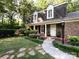 Inviting front entrance with a walkway and lush plantings at 101 Treeline Dr, Belmont, NC 28012