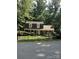 Traditional two-story home with neutral siding, dormer windows, front yard, and mature trees at 101 Treeline Dr, Belmont, NC 28012