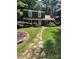 Charming two-story home with landscaped yard and a stone walkway leading to the front door at 101 Treeline Dr, Belmont, NC 28012