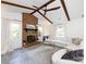 Spacious living room with brick fireplace, wood beams, and comfortable seating for relaxation and gatherings at 101 Treeline Dr, Belmont, NC 28012