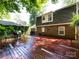Spacious wood deck on a brick home, creating a relaxing outdoor living space with a built-in grill at 101 Treeline Dr, Belmont, NC 28012