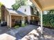 Backyard of brick home with covered patio and well-kept landscaping, providing a private outdoor space at 101 Treeline Dr, Belmont, NC 28012