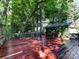 Spacious wood deck with lush green surroundings, offering a private oasis for outdoor enjoyment at 101 Treeline Dr, Belmont, NC 28012