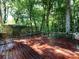 Large wood deck surrounded by lush green foliage, perfect for outdoor entertaining or relaxation at 101 Treeline Dr, Belmont, NC 28012