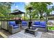 Spacious back deck with comfortable seating, a gazebo, and outdoor heater is perfect for entertaining at 1104 Pump Station Rd, Kannapolis, NC 28081