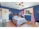 Bedroom with window, door and blue walls at 1104 Pump Station Rd, Kannapolis, NC 28081