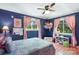 Bedroom with blue walls and two windows at 1104 Pump Station Rd, Kannapolis, NC 28081