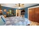 Comfortable bedroom with a blue accent wall, ample storage, and a cozy bed, creating a relaxing atmosphere at 1104 Pump Station Rd, Kannapolis, NC 28081
