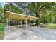 Spacious carport with sturdy support beams, providing ample covered parking at 1104 Pump Station Rd, Kannapolis, NC 28081