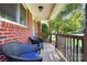 Inviting front porch features comfortable seating and a view of lush greenery, perfect for relaxation at 1104 Pump Station Rd, Kannapolis, NC 28081
