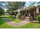 Charming front porch features a 'Welcome' sign, inviting steps, and decorative landscaping around the walkway at 1104 Pump Station Rd, Kannapolis, NC 28081