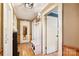 Inviting hallway with wood floors, hall tree, and neutral paint at 1104 Pump Station Rd, Kannapolis, NC 28081