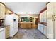 Open kitchen layout with island, cabinetry, and modern appliances, offering functionality and style for cooking and dining at 1104 Pump Station Rd, Kannapolis, NC 28081