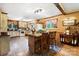 Charming kitchen with wooden island, vintage decor, and ample natural light, creating a warm and inviting space at 1104 Pump Station Rd, Kannapolis, NC 28081