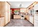 Spacious kitchen with light wood cabinets, modern appliances, and durable flooring, ready for culinary adventures at 1104 Pump Station Rd, Kannapolis, NC 28081