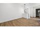 Open dining area showcasing sleek flooring, modern lighting, and adjacent staircase at 1108 4Th St, Statesville, NC 28677