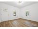 Bright living room with two windows, white walls and modern flooring at 1108 4Th St, Statesville, NC 28677