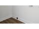 Room corner with luxury vinyl plank flooring, white walls, and baseboards at 1108 4Th St, Statesville, NC 28677