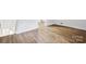 Luxury vinyl plank flooring with white baseboards and white walls near stairs at 1108 4Th St, Statesville, NC 28677