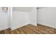 Room with luxury vinyl plank flooring, window, and white baseboards at 1108 4Th St, Statesville, NC 28677