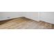 Luxury vinyl plank flooring with white baseboards and white walls at 1108 4Th St, Statesville, NC 28677