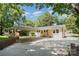 View of the house from the backyard with mature trees at 1138 Laurel St, Salisbury, NC 28144