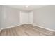 Bright bedroom featuring hardwood floors, closet, and a ceiling fan at 1138 Laurel St, Salisbury, NC 28144
