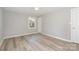 Bright bedroom featuring hardwood floors, a window, and neutral paint at 1138 Laurel St, Salisbury, NC 28144