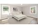 Sunlit bedroom with neutral decor, a comfortable bed, and matching bedside tables creating a cozy atmosphere at 1138 Laurel St, Salisbury, NC 28144
