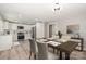 Dining area and kitchen with white cabinets and stainless steel appliances at 1138 Laurel St, Salisbury, NC 28144
