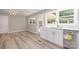 Bright kitchen featuring white cabinetry, stainless steel appliances, and durable grey wood-look flooring at 1138 Laurel St, Salisbury, NC 28144