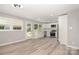 Well-lit kitchen with white cabinetry, stainless steel appliances, and access to the backyard at 1138 Laurel St, Salisbury, NC 28144