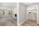 Open-concept living area with wood floors, fireplace, and abundant natural light at 1138 Laurel St, Salisbury, NC 28144