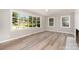 Bright living room with large windows and wood floors at 1138 Laurel St, Salisbury, NC 28144