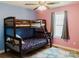 ' bedroom with colorful walls, wood-look floors, and a bunk bed at 118 Cypress Acres Ln, Statesville, NC 28625